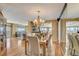 Elegant dining room with hardwood floors and water views at 1651 Sand Key Estates Ct # 52, Clearwater, FL 33767