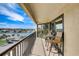 Spacious balcony with water views and seating area at 1651 Sand Key Estates Ct # 52, Clearwater, FL 33767