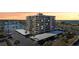 Stunning aerial view of a waterfront condo building with covered parking and boat docks, perfect for coastal living at 1651 Sand Key Estates Ct # 52, Clearwater, FL 33767