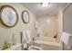 Bathroom with a bathtub and updated fixtures at 1651 Sand Key Estates Ct # 52, Clearwater, FL 33767