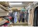 Walk-in closet with ample shelving and hanging space at 1651 Sand Key Estates Ct # 52, Clearwater, FL 33767