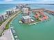 Aerial view of waterfront property with boat slips at 1651 Sand Key Estates Ct # 52, Clearwater, FL 33767