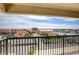 Balcony overlooking tennis courts and waterfront at 1651 Sand Key Estates Ct # 52, Clearwater, FL 33767