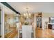 Bright dining room with hardwood floors, a chandelier, and a built-in hutch at 1651 Sand Key Estates Ct # 52, Clearwater, FL 33767