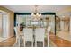 Bright dining room with hardwood floors and chandelier at 1651 Sand Key Estates Ct # 52, Clearwater, FL 33767