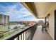 Balcony with water views and seating for two at 1651 Sand Key Estates Ct # 52, Clearwater, FL 33767