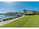 Scenic waterfront community with a pier, lush landscaping, and condo buildings at 19029 Us Highway 19 N # 25A, Clearwater, FL 33764