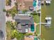 Aerial view of waterfront home with private dock at 208 Driftwood Ln, Largo, FL 33770