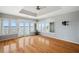 Main bedroom with hardwood floors, water views and a ceiling fan at 208 Driftwood Ln, Largo, FL 33770