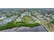 Aerial view showcasing home's location in waterfront community at 303 Windrush Loop, Tarpon Springs, FL 34689