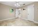 Bright bedroom with tile floors and ceiling fan at 303 Windrush Loop, Tarpon Springs, FL 34689