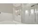 Spa-like bathroom with a large walk-in shower, soaking tub and double vanity at 3845 Seena Manor Ct, Tampa, FL 33618