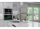 Modern kitchen with white cabinets, quartz countertops, and a stylish sink at 3845 Seena Manor Ct, Tampa, FL 33618