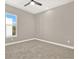 Well-lit bedroom featuring neutral walls, carpet flooring and a window with a view at 3845 Seena Manor Ct, Tampa, FL 33618