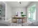 Home office with built-in desk and access to a private bathroom and backyard at 3845 Seena Manor Ct, Tampa, FL 33618