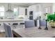Elegant kitchen features white cabinets, a large island, and hardwood floors at 3845 Seena Manor Ct, Tampa, FL 33618