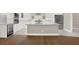 Kitchen with white cabinets, stainless steel appliances, and an island at 3845 Seena Manor Ct, Tampa, FL 33618