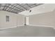 Spacious garage with high ceilings and an automatic garage door opener at 3845 Seena Manor Ct, Tampa, FL 33618