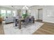 Bright dining room features hardwood floors and a rustic wooden table with seating for six at 3845 Seena Manor Ct, Tampa, FL 33618