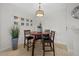 Dining area with wood table and four chairs, decorative lighting at 5000 Culbreath Key Way # 4-206, Tampa, FL 33611