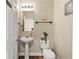 Clean bathroom with pedestal sink and toilet at 5434 Sandy Shell Dr, Apollo Beach, FL 33572