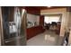 Kitchen features stainless steel refrigerator and wood cabinets at 5860 38Th N Ave # 36, St Petersburg, FL 33710