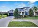 Two-story house with a gray and blue exterior at 6917 Paradiso Dr, Apollo Beach, FL 33572