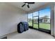 Covered patio with screened enclosure, ceiling fan, and grill at 6917 Paradiso Dr, Apollo Beach, FL 33572