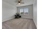 Spacious bedroom with carpeted floor, two windows, and ceiling fan at 6917 Paradiso Dr, Apollo Beach, FL 33572