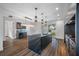 Modern kitchen with dark cabinetry, marble island, and stainless steel appliances at 752 30Th S Ave, St Petersburg, FL 33705