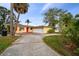 Yellow house with red door and attached garage at 918 Snell Isle Ne Blvd, St Petersburg, FL 33704