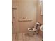 Toilet in bathroom featuring hand rails, mosaic tile and a sink at 10006 N Mitchell Ave, Tampa, FL 33612