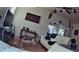 Living room featuring hardwood floors, a ceiling fan, and contemporary decor at 10006 N Mitchell Ave, Tampa, FL 33612