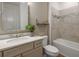 Clean bathroom with neutral tile and bathtub at 11365 Osprey Preserve Pl, Riverview, FL 33569