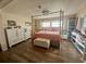 Spacious main bedroom with a king-size bed and built-in shelving at 125 Lake Tarpon Dr # 21, Palm Harbor, FL 34684