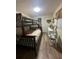 Well-lit bedroom featuring a full-over-full bunk bed at 125 Lake Tarpon Dr # 21, Palm Harbor, FL 34684
