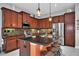 Modern kitchen with stainless steel appliances and granite countertops at 1647 Emerald Dunes Dr, Sun City Center, FL 33573