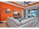 Bright living room with sectional sofa and large TV at 1647 Emerald Dunes Dr, Sun City Center, FL 33573