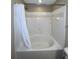Bathroom with a rounded bathtub and shower at 1910 E Palm Ave # 13102, Tampa, FL 33605