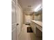 Bathroom with a bathtub, double vanity, and tile floors at 1910 E Palm Ave # 13102, Tampa, FL 33605