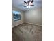 Bright bedroom featuring a ceiling fan and window at 1910 E Palm Ave # 13102, Tampa, FL 33605