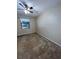 Well-lit bedroom with ceiling fan and window at 1910 E Palm Ave # 13102, Tampa, FL 33605