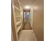 Hallway with built-in shelves and carpet at 1910 E Palm Ave # 13102, Tampa, FL 33605