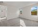 Well lit bedroom with carpet flooring and two windows at 20345 Symphony Pl, Venice, FL 34293