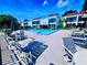 Relaxing community pool area with lounge chairs at 2060 Marilyn St # 239, Clearwater, FL 33765