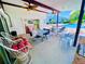 Community pool area with covered patio and seating at 2060 Marilyn St # 239, Clearwater, FL 33765