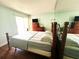 Bright bedroom with sliding glass door and hardwood floors at 2060 Marilyn St # 239, Clearwater, FL 33765