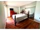 Bedroom features hardwood floors, mirrored wall, and abundant natural light at 2060 Marilyn St # 239, Clearwater, FL 33765