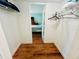 Walk-in closet with wood floors and wire shelving at 2060 Marilyn St # 239, Clearwater, FL 33765