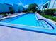 Community pool with ample lounge chairs at 2060 Marilyn St # 239, Clearwater, FL 33765